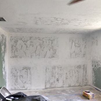 Interior room with drywall primer and pencil sketches on walls